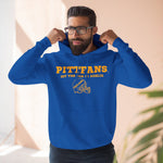 Man wearing a blue hoodie with 'PITT FANS' text, standing indoors.